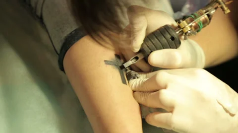 Master Makes Tattoo On Leg Stock Footage 38385714