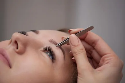 Master makeup corrects  eyebrows Stock Photos