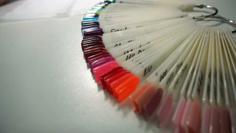 The master of the manicure grinds the nails with a machine, Stock Footage 90382168