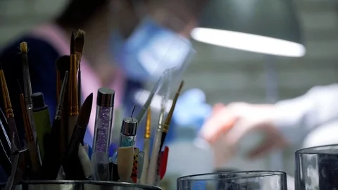 Master of manicure in a mask Stock Footage 87586299