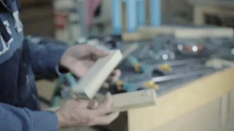 Master Measures the Board in the Workshop Stock Footage 60660945