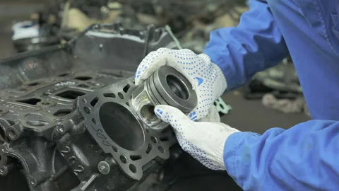 The master measures the diameter of the engine cylinders. Stock Footage 97542332