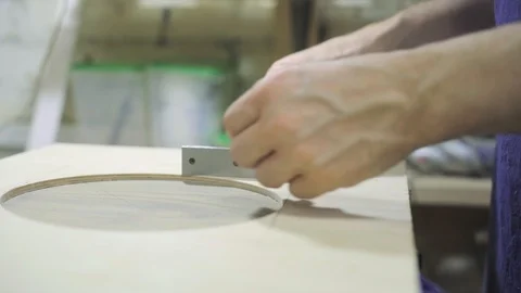 Master is measuring with metal ruler and drawing with pencil Stock Footage 102858712