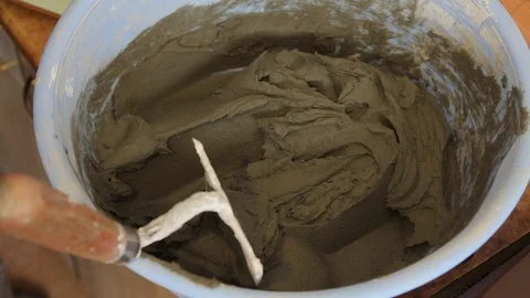 Master mixes glue for tiles. Stock Footage 101685437