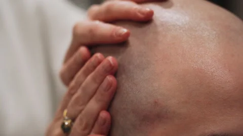 The master moisturizes the head with gel Stock Footage 157621195