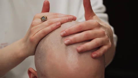 The master moisturizes the head with gel Stock Footage 157621204