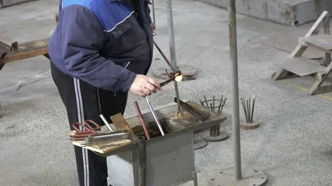 A master of molten glass makes handmade souvenirs Stock Footage 303545004