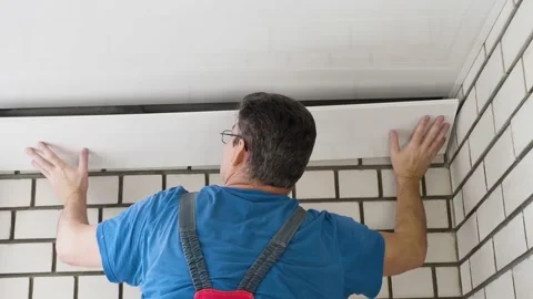 Master mounts the ceiling from plastic panels Video stock 167784582