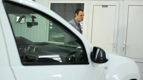 The master opens the hood and checks the engine Stock Footage 74375046