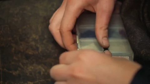 Master opens a plastic box with precious stones 스톡 동영상 73463932