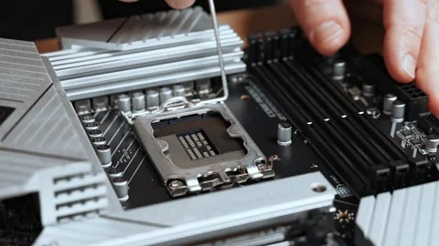 Master opens socket on motherboard. PC assembly. Stock Footage 326500677