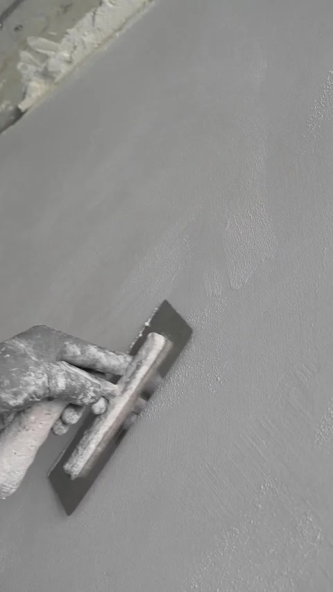 Master painter builder smooths decorative plaster. forms a finishing coating Stock Footage 317409575