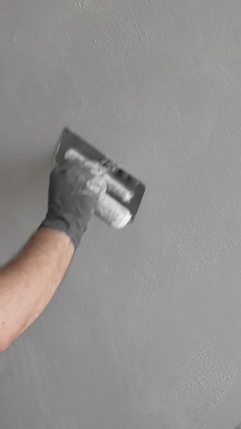 Master painter builder smooths decorative plaster. forms a finishing coating Video stock 317409580