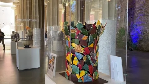 Master pastry chefs reinterpret Gaudí work with Easter eggs at Park Güell, Barce Stock Footage 330953369