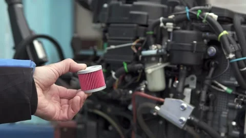 The master performs comprehensive diagnostics and repairs of the outboard motor. Stock-Footage 265864822
