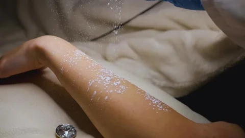 A master performs an electrodepilation procedure on a girl's arm Stock Footage 270173716