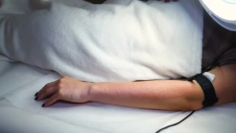 A master performs an electrodepilation procedure on a girl's arm Stock Footage 270173756