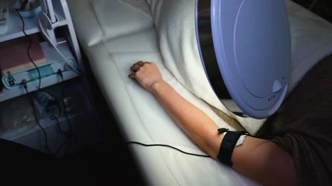 A master performs an electrodepilation procedure on a girl's arm Stock Footage 270173767