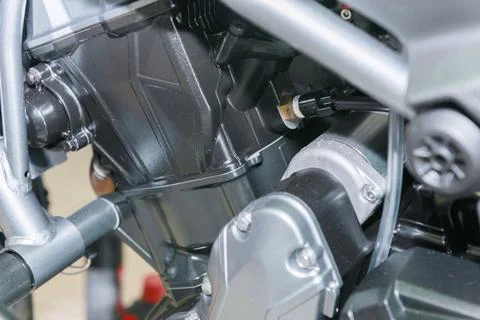 The master performs maintenance on the motorcycle. Stock Photos