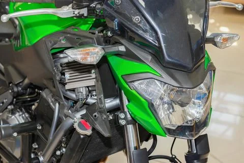 The master performs maintenance on the motorcycle. Stock Photos