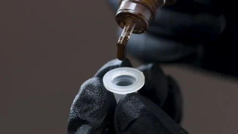 Master permanent makeup attaching micro needle on tattoo machine Stock-Footage 276851198