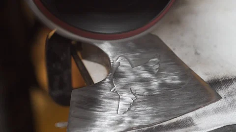 The master polishes the axe, close-up Stock Footage 129693599