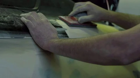 Master polishes the car body before painting Stock Footage