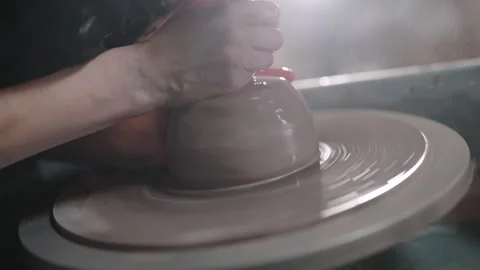 Master pottery techniques with a clay molding pottery wheel at the studio Stock Footage 319991204