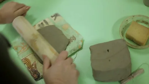 The master prepares clay for making a souvenir. Work process in an art workshop Stock Footage 81602060