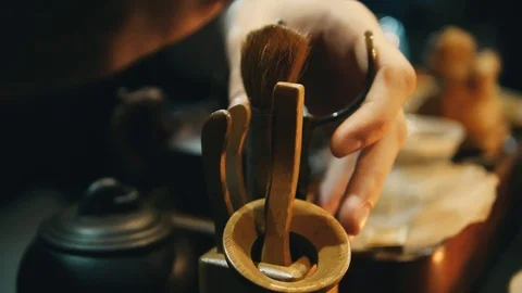 Master prepares a tea ceremony, chinese teapot, wooden stick. Stock Footage 107517058