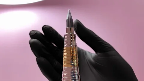 Master prepares tools for work. Cosmetology procedure. Applying red permanent Stock Footage 119892425