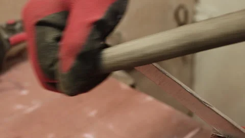 The master processes an iron part with a file. Stock Footage 156176064