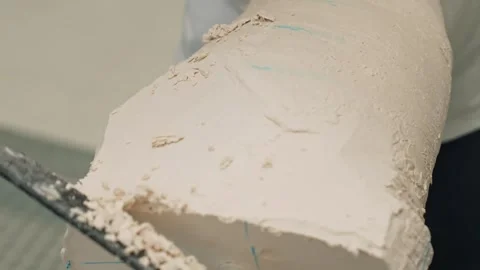 The master of prosthetics prepares a plaster mold for a prosthetic leg. The Stock Footage 263206248