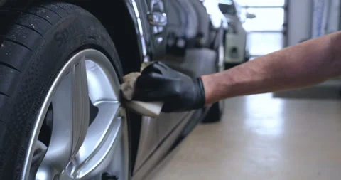 Master in protective suit paint paint sprayer car disc Stock Footage 108807606