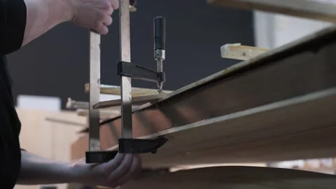 Master pulls the clamp Board surf Board Stock Footage 132258198