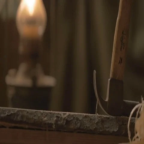 Master pulls the nails out of the Board with a claw hammer. The workshop tool Video stock 69518008