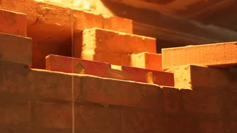 Master puts bricks. Making a wood rustic stove Stock Footage 123720460