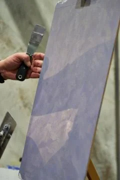 The master puts decorative plaster. Stock Photos