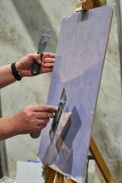 The master puts decorative plaster. Stock Photos