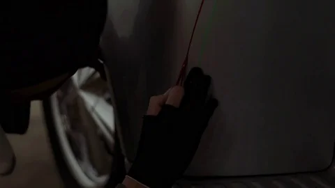 Master puts drawing on the car in style Pinstripe Video stock 70469424