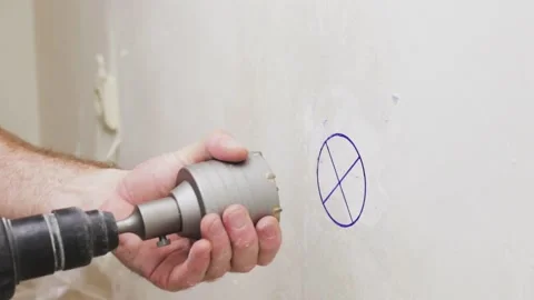 The master puts a drill bit on the perforator for drilling concrete Stock Footage 147172803