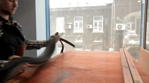 The master puts the leather blanks under the waistband on the table. Leather Stock Footage 86659127