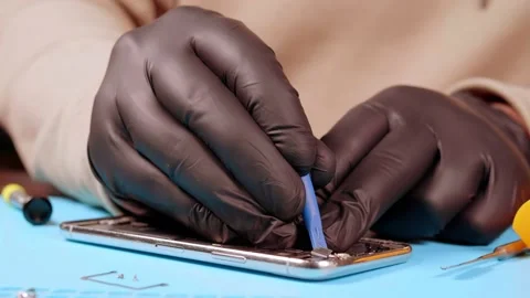 The master removes the camera from the smartphone Stock Footage 172058335