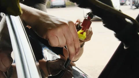 Master removes unevenness on surface of car in workshop 스톡 동영상 316179556