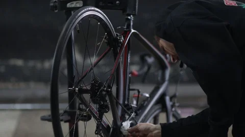 The master repairs the bike in the workshop Stock Footage 105877791