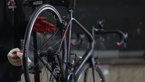 The master repairs the bike in the workshop Stock Footage 105877822