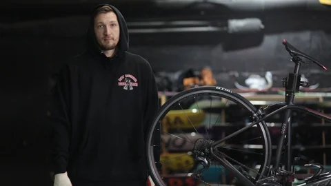The master repairs the bike in the workshop Stock Footage 105877843