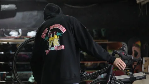 The master repairs the bike in the workshop Stock Footage 105877845