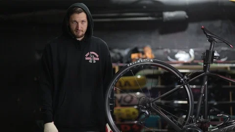 The master repairs the bike in the workshop Stock Footage 105877858