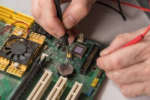Master repairs chip electronics technician is testing a computer chip. PC ... 스톡 사진